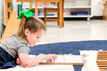 Primary child working on math